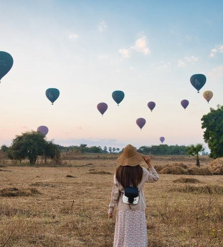 woman, field, hot air balloons